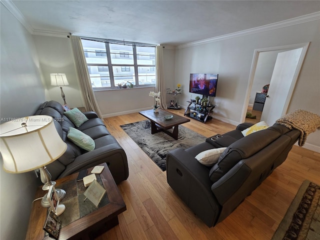 5825 Collins Ave Unit 2D, Miami Beach, FL 33140 - living area featuring crown molding, hardwood / wood-style flooring, and baseboards