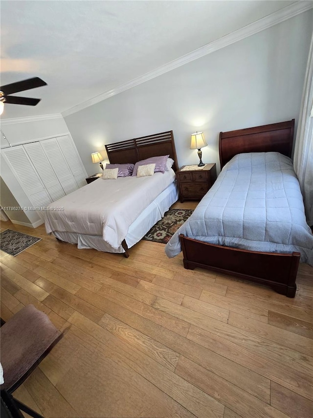 5825 Collins Ave Unit 2D, Miami Beach, FL 33140 - bedroom featuring hardwood / wood-style floors, a ceiling fan, baseboards, and crown molding