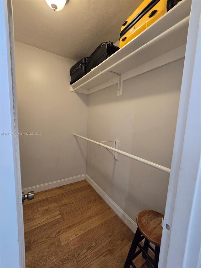 5825 Collins Ave Unit 2D, Miami Beach, FL 33140 - spacious closet with wood finished floors