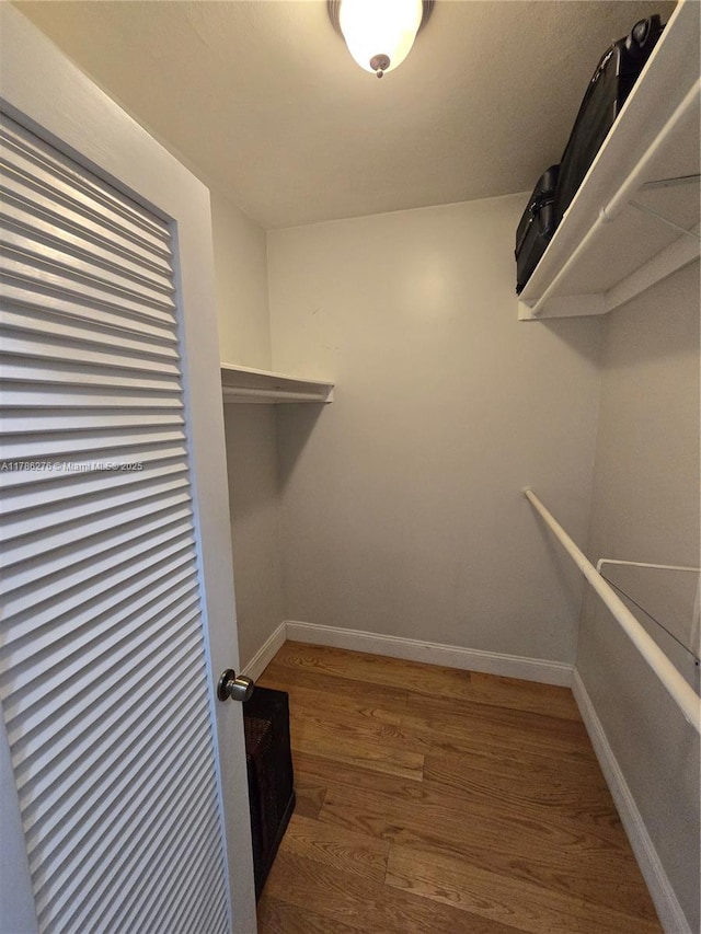 5825 Collins Ave Unit 2D, Miami Beach, FL 33140 - walk in closet with wood finished floors
