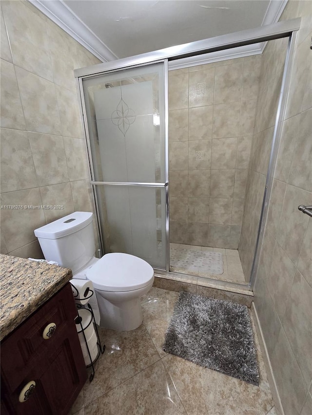 5825 Collins Ave Unit 2D, Miami Beach, FL 33140 - bathroom featuring a stall shower, vanity, tile walls, toilet, and ornamental molding