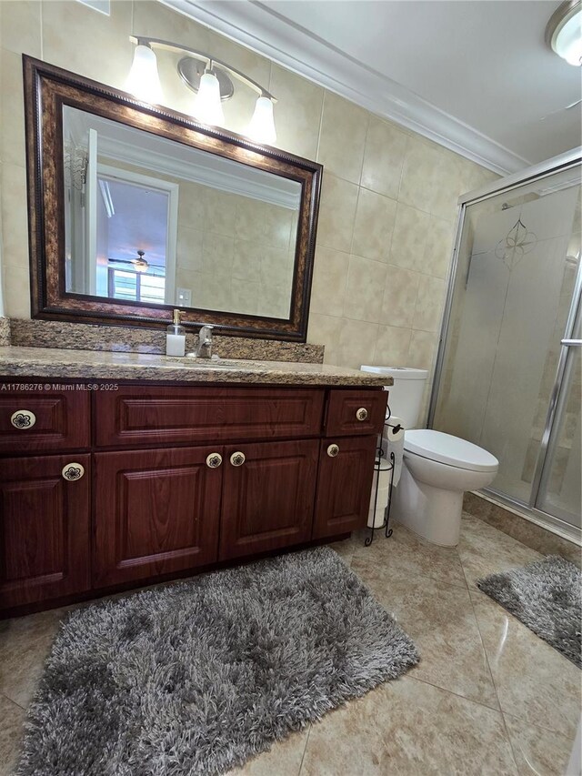 5825 Collins Ave Unit 2D, Miami Beach, FL 33140 - full bath with a shower stall, toilet, ornamental molding, and vanity