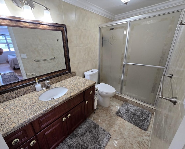 5825 Collins Ave Unit 2D, Miami Beach, FL 33140 - ensuite bathroom featuring toilet, vanity, a shower stall, and crown molding