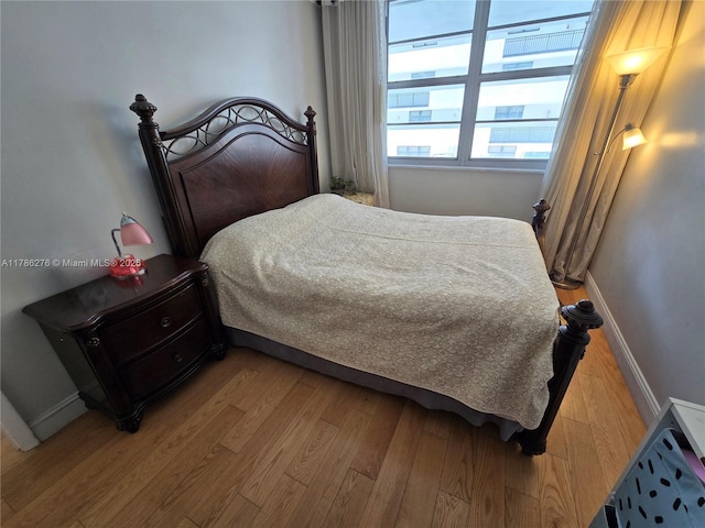 5825 Collins Ave Unit 2D, Miami Beach, FL 33140 - bedroom with light wood finished floors and baseboards