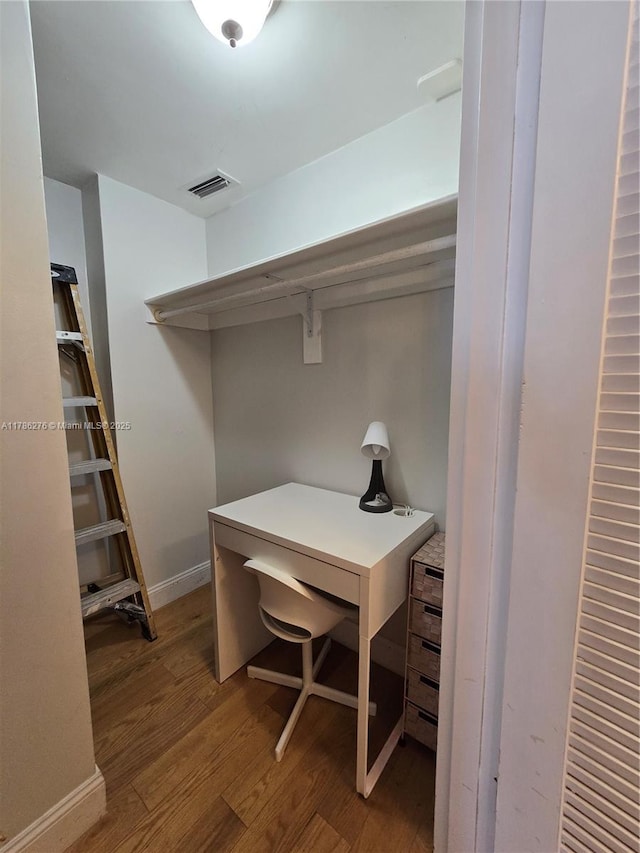 5825 Collins Ave Unit 2D, Miami Beach, FL 33140 - office space featuring baseboards, wood finished floors, and visible vents