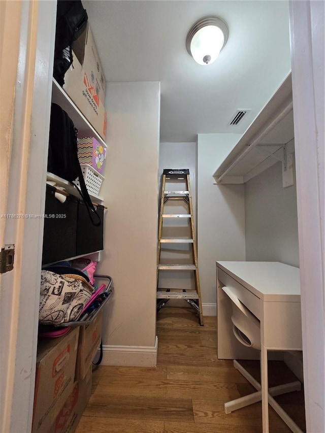 5825 Collins Ave Unit 2D, Miami Beach, FL 33140 - spacious closet with wood finished floors and visible vents