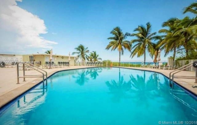 5825 Collins Ave Unit 2D, Miami Beach, FL 33140 - community pool with a patio area