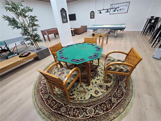 5825 Collins Ave Unit 2D, Miami Beach, FL 33140 - playroom with baseboards and wood finished floors