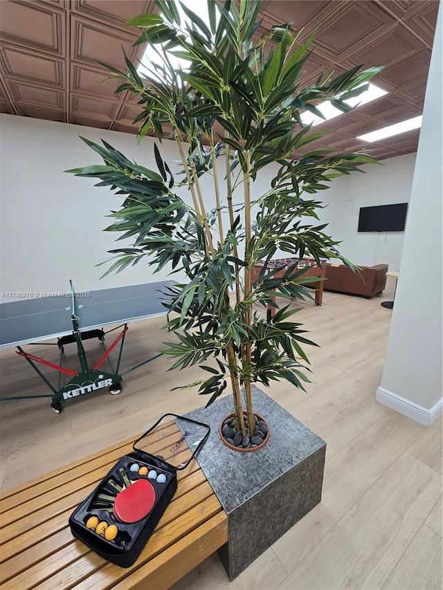 5825 Collins Ave Unit 2D, Miami Beach, FL 33140 - room details with an ornate ceiling, wood finished floors, and baseboards