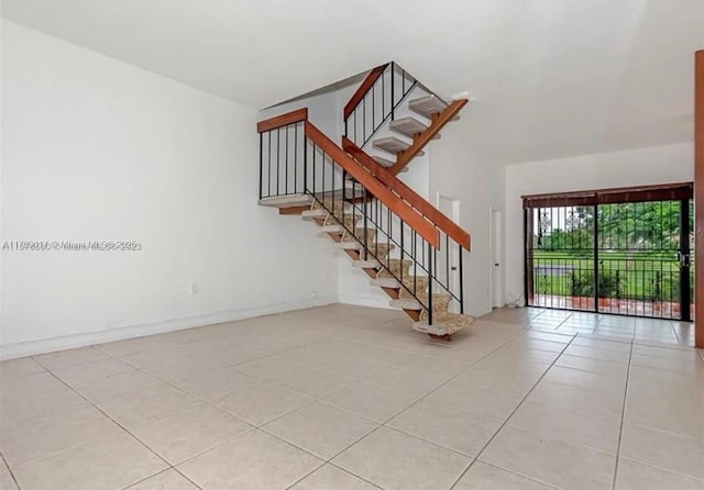 717 NW 105th Pl Unit C2, Miami, FL 33172 - stairway featuring tile patterned floors and baseboards