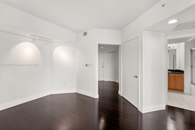 1330 W Ave Unit 1614, Miami Beach, FL 33139 - spare room with baseboards, wood finished floors, and visible vents
