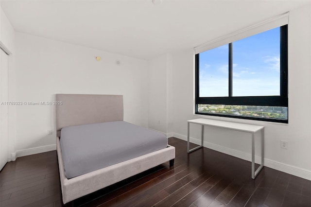 1330 W Ave Unit 1614, Miami Beach, FL 33139 - bedroom featuring baseboards and dark wood-style floors