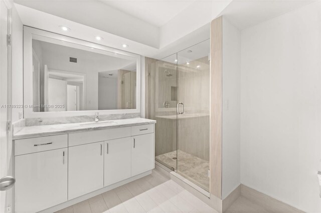 1330 W Ave Unit 1614, Miami Beach, FL 33139 - bathroom featuring visible vents, recessed lighting, vanity, and a stall shower