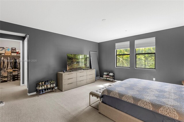 carpeted bedroom with baseboards