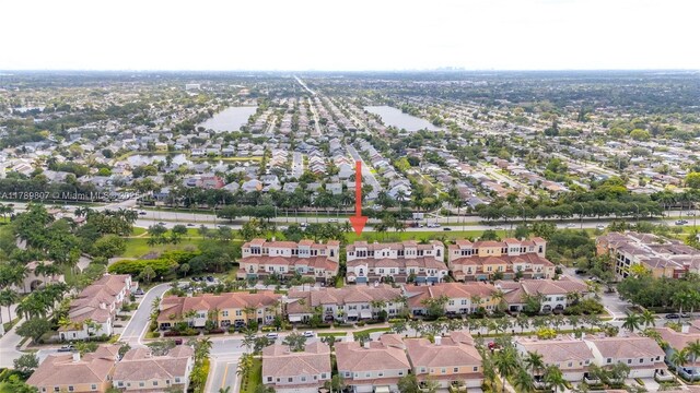 birds eye view of property featuring a residential view and a water view