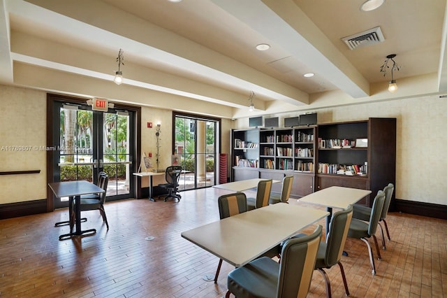 dining room featuring beamed ceiling, french doors, hardwood / wood-style floors, and visible vents