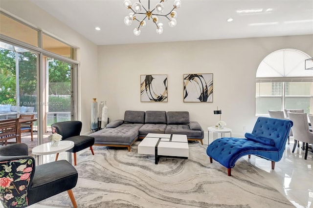 living area featuring recessed lighting and a notable chandelier