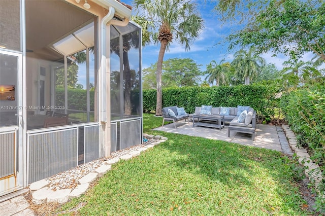 view of yard featuring outdoor lounge area, a sunroom, and a patio area