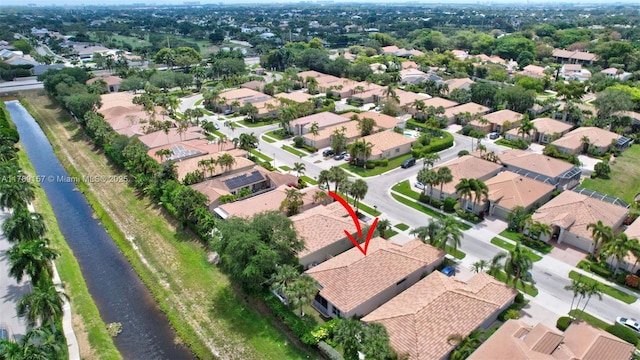 aerial view featuring a residential view and a water view