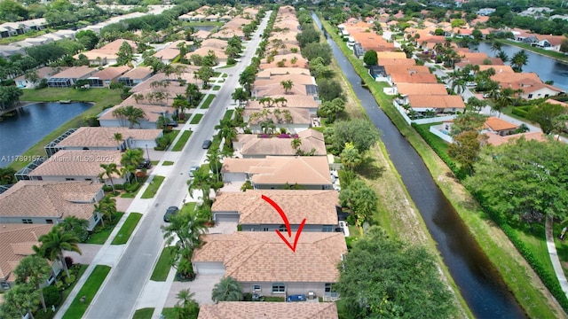 aerial view with a water view and a residential view