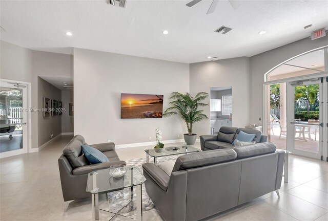 living room featuring recessed lighting, visible vents, and a healthy amount of sunlight