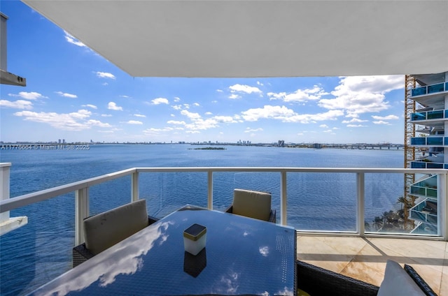 665 NE 25th St Unit 1201, Miami, FL 33137 - balcony featuring outdoor dining area and a water view