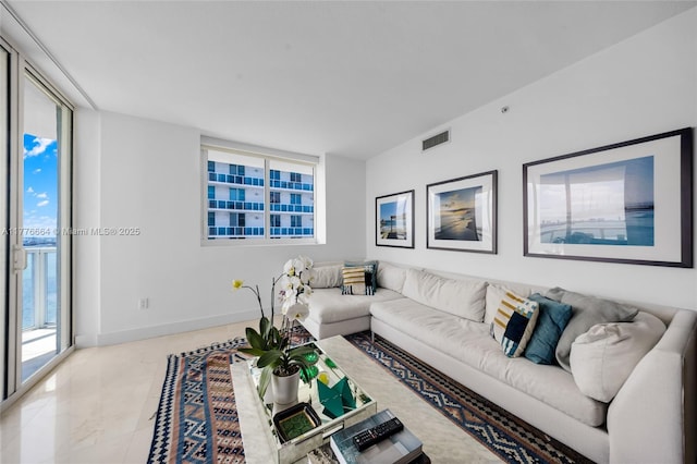 665 NE 25th St Unit 1201, Miami, FL 33137 - living room featuring baseboards and visible vents