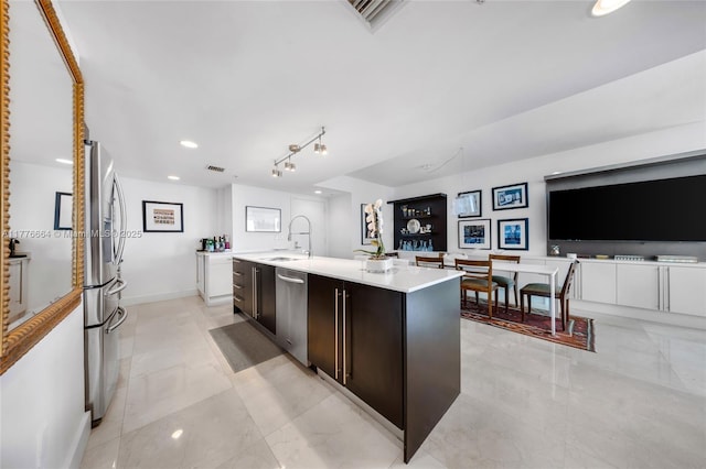 665 NE 25th St Unit 1201, Miami, FL 33137 - kitchen featuring stainless steel appliances, a kitchen island with sink, a sink, recessed lighting, and light countertops