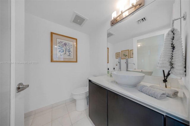 665 NE 25th St Unit 1201, Miami, FL 33137 - bathroom with toilet, vanity, tile patterned floors, and visible vents