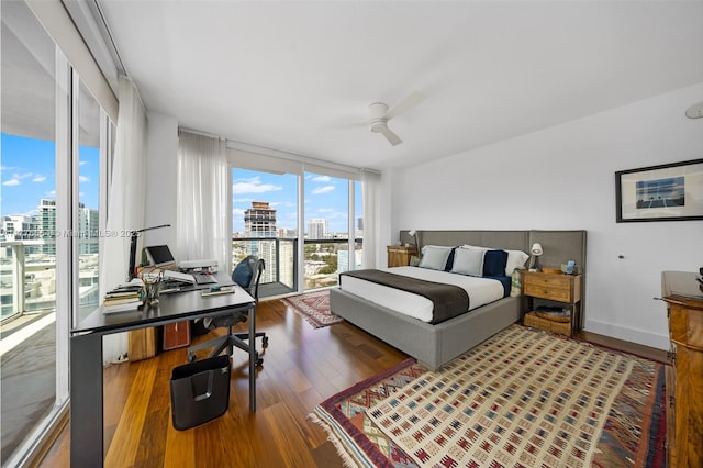 665 NE 25th St Unit 1201, Miami, FL 33137 - bedroom with a city view, wood finished floors, and a ceiling fan