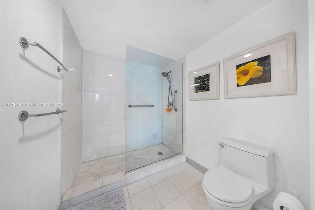 665 NE 25th St Unit 1201, Miami, FL 33137 - full bathroom with tile patterned floors, a walk in shower, and toilet