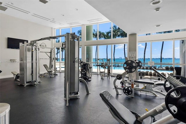 665 NE 25th St Unit 1201, Miami, FL 33137 - gym featuring a water view and a towering ceiling