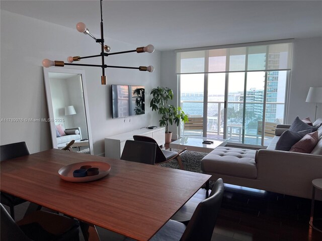 1155 Brickell Bay Dr Unit 1707, Miami, FL 33131 - dining room featuring a notable chandelier and floor to ceiling windows