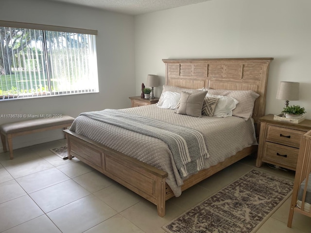 bedroom with light tile patterned flooring
