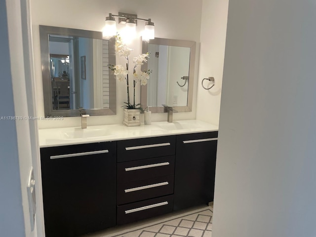 full bathroom featuring a sink and double vanity