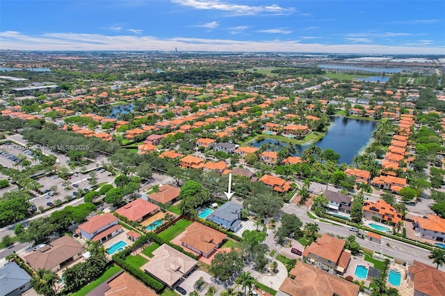 birds eye view of property featuring a water view and a residential view