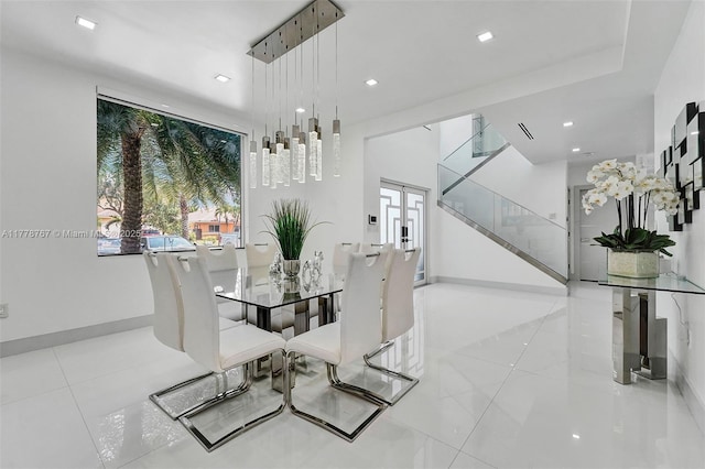 dining area featuring baseboards, tile patterned flooring, and recessed lighting
