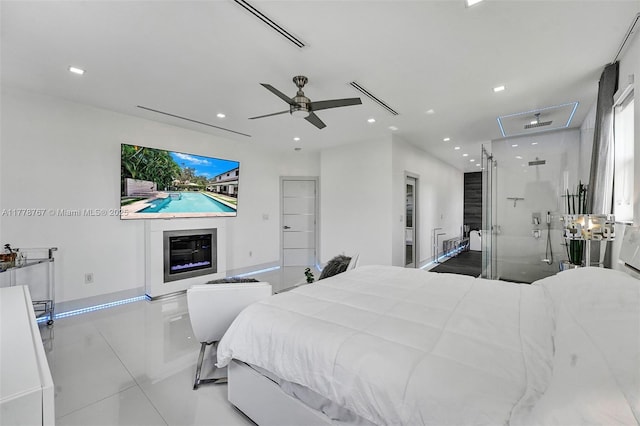 bedroom with recessed lighting, tile patterned floors, and baseboards