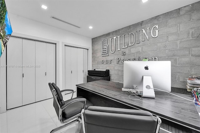 tiled office space with recessed lighting and visible vents