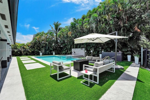 view of pool featuring a lawn, an outdoor living space, and a fenced in pool