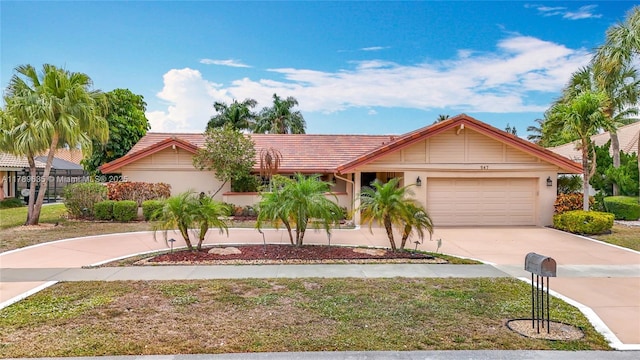 547 Deer Creek Run, Deerfield Beach, FL 33442 - ranch-style house featuring a garage, stucco siding, a tiled roof, and concrete driveway
