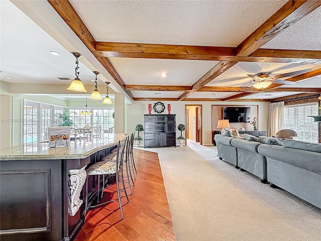 547 Deer Creek Run, Deerfield Beach, FL 33442 - interior space featuring beamed ceiling, a wealth of natural light, coffered ceiling, and light wood finished floors