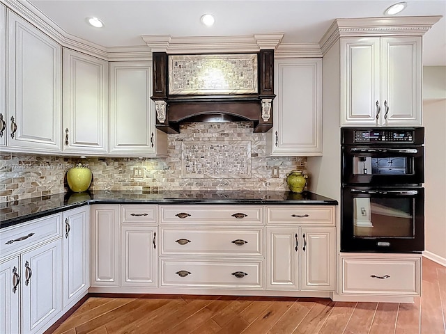 547 Deer Creek Run, Deerfield Beach, FL 33442 - kitchen with recessed lighting, tasteful backsplash, light wood finished floors, and black appliances