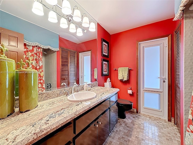 547 Deer Creek Run, Deerfield Beach, FL 33442 - bathroom featuring baseboards, toilet, and vanity