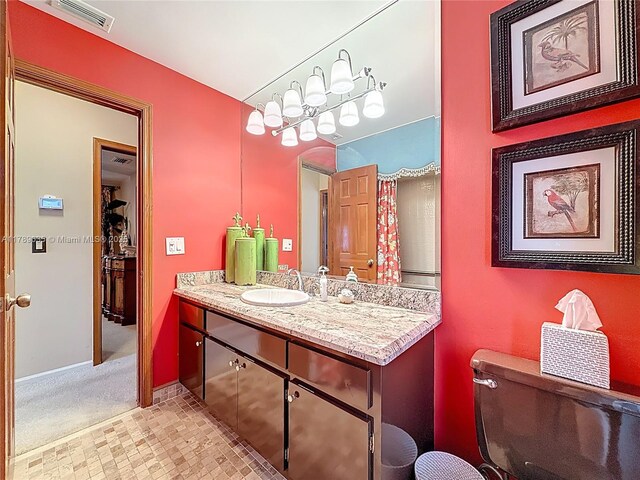 547 Deer Creek Run, Deerfield Beach, FL 33442 - bathroom featuring baseboards, visible vents, toilet, and vanity
