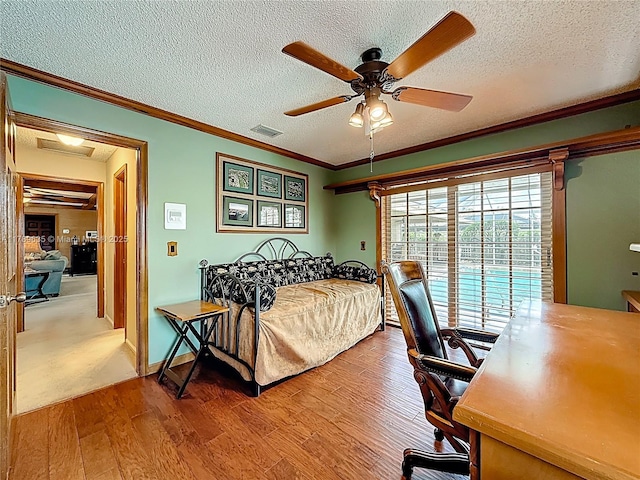 547 Deer Creek Run, Deerfield Beach, FL 33442 - bedroom featuring crown molding, wood finished floors, a textured ceiling, ceiling fan, and visible vents