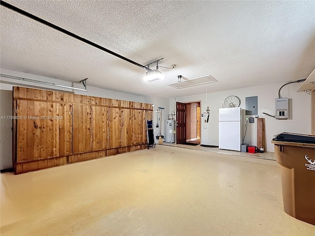 547 Deer Creek Run, Deerfield Beach, FL 33442 - garage featuring water heater, freestanding refrigerator, electric panel, and a garage door opener