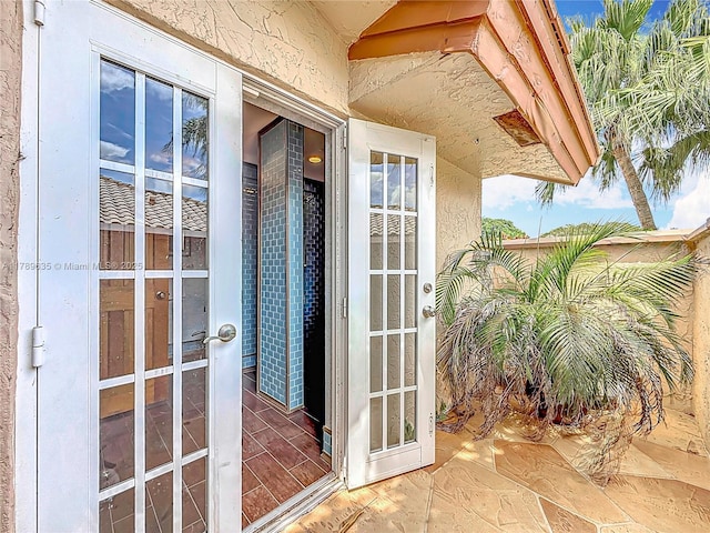 547 Deer Creek Run, Deerfield Beach, FL 33442 - entrance to property with stucco siding
