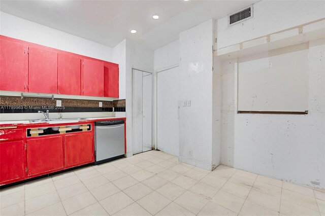 151 Crandon Blvd Unit 138, Key Biscayne, FL 33149 - kitchen with stainless steel dishwasher, red cabinetry, visible vents, light floors, and a sink