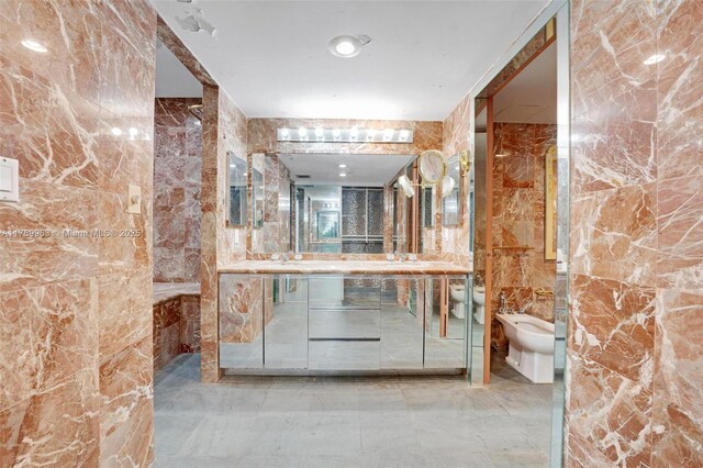 151 Crandon Blvd Unit 138, Key Biscayne, FL 33149 - full bath featuring tile walls, vanity, a bidet, and marble finish floor